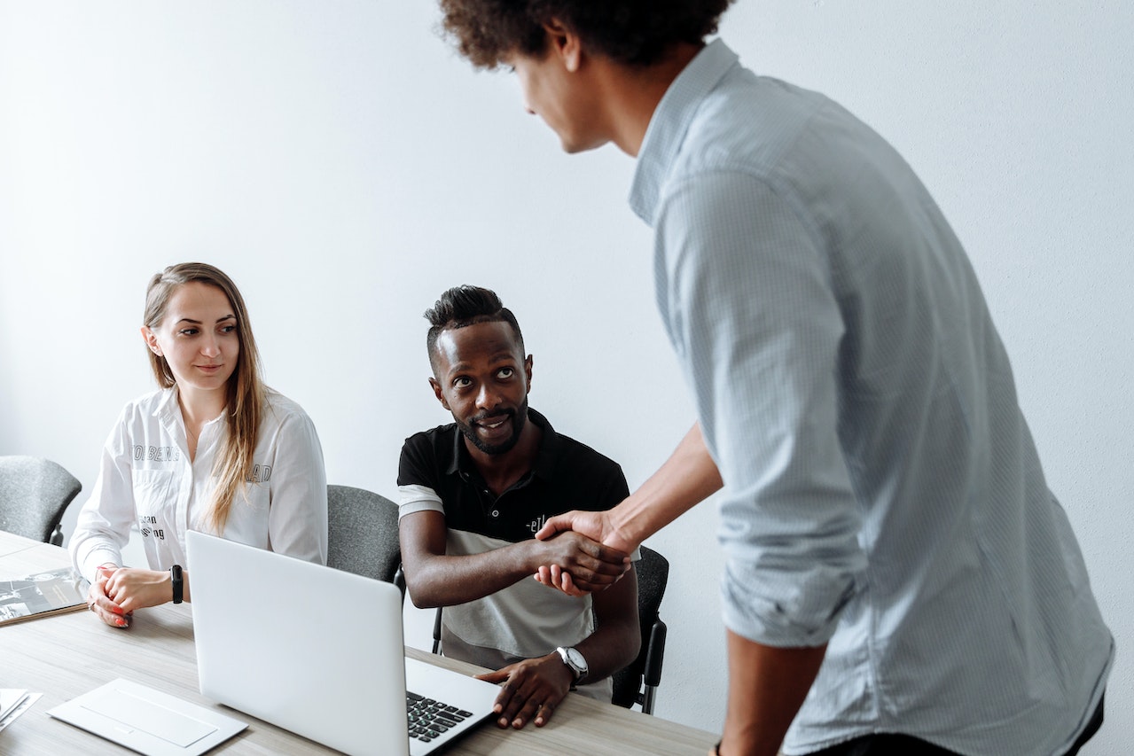 manager-greeting-colleague-at-office-appreciation-for-good-work-messages