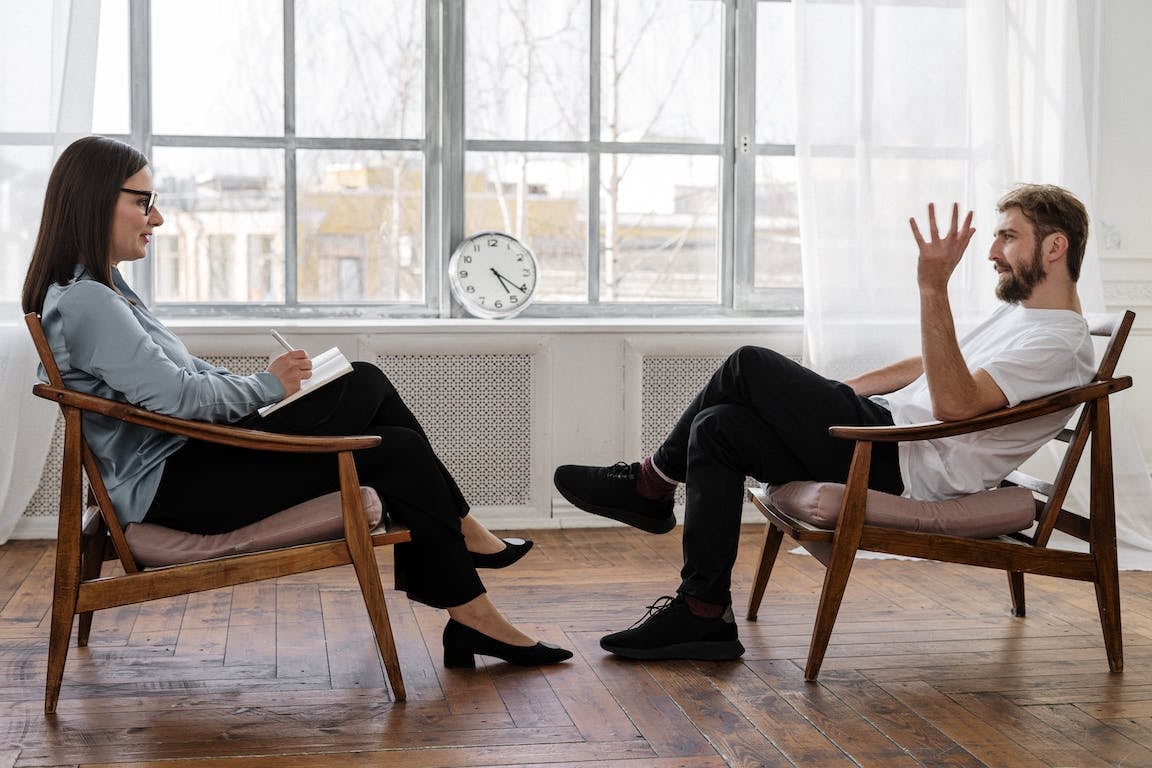 person-sits-with-coach-learning-to-stop-being-jealous