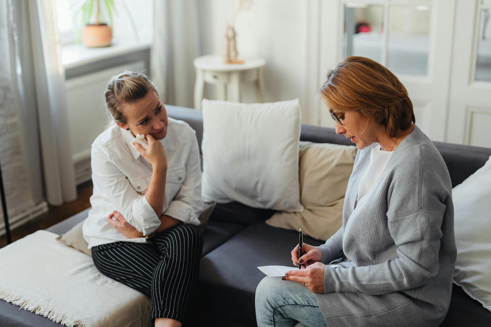 person-sits-with-coach-discussing-vulnerability-hangover