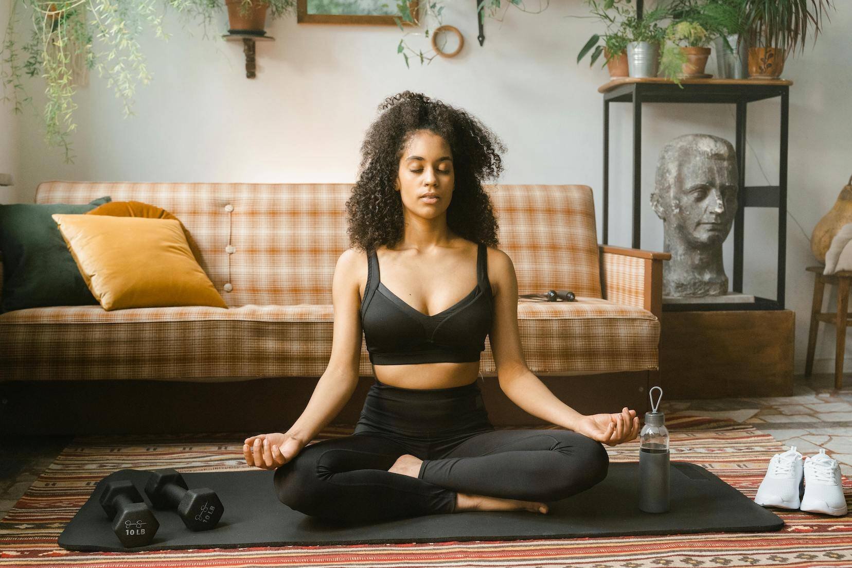 woman-meditates-in-living-room-managing-sense-of-impending-doom