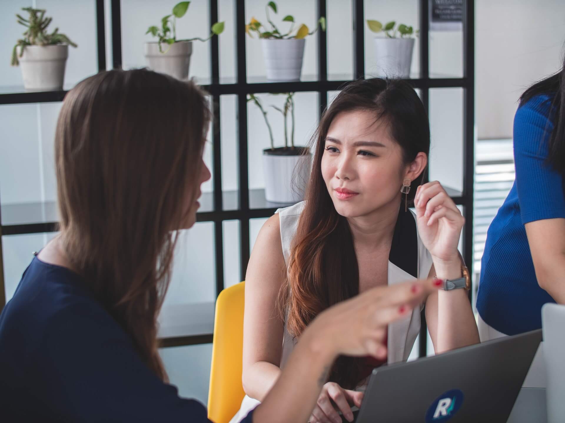 two women talking at work about kindness