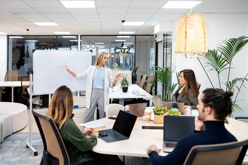 woman-during-a-meeting-breaking-glass-ceilings