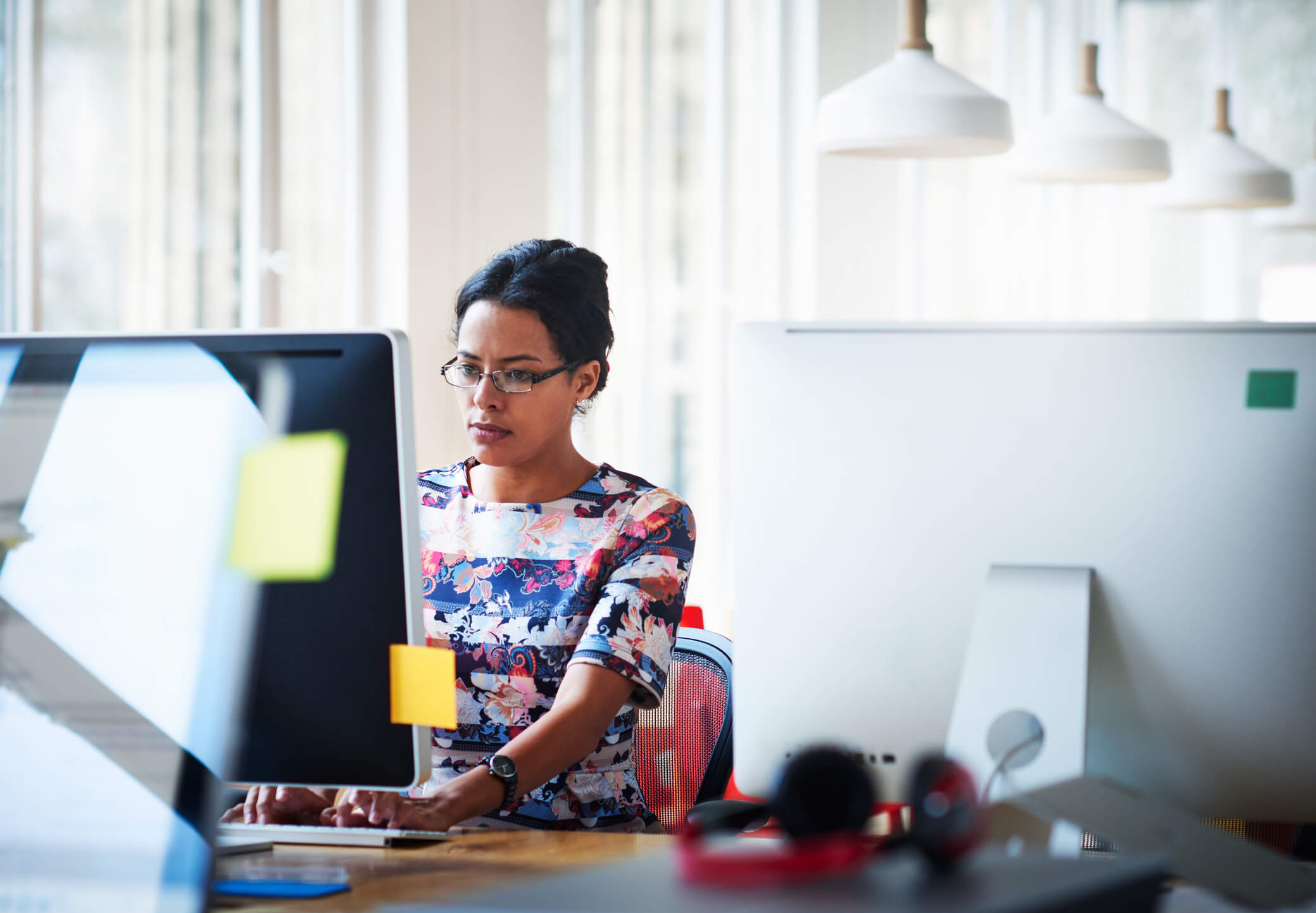 woman working at a computer with grit