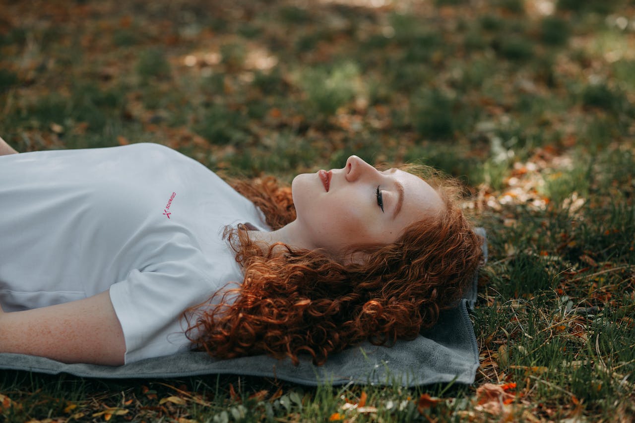 woman-laying-on-ground