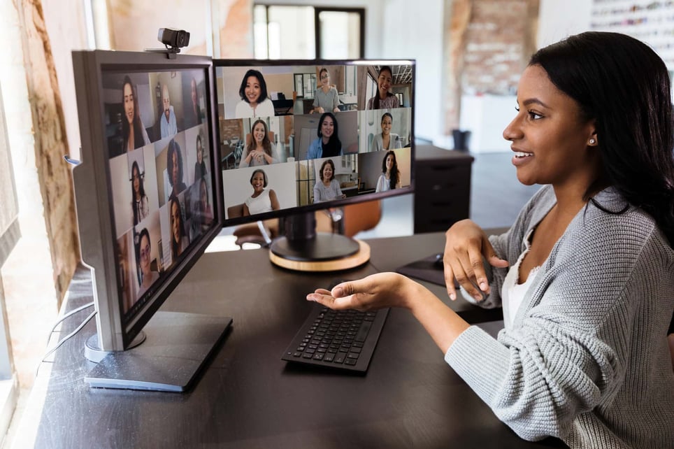 woman-on-a-two-screen-work-video-call-ice-breakers-for-virtual-meetings