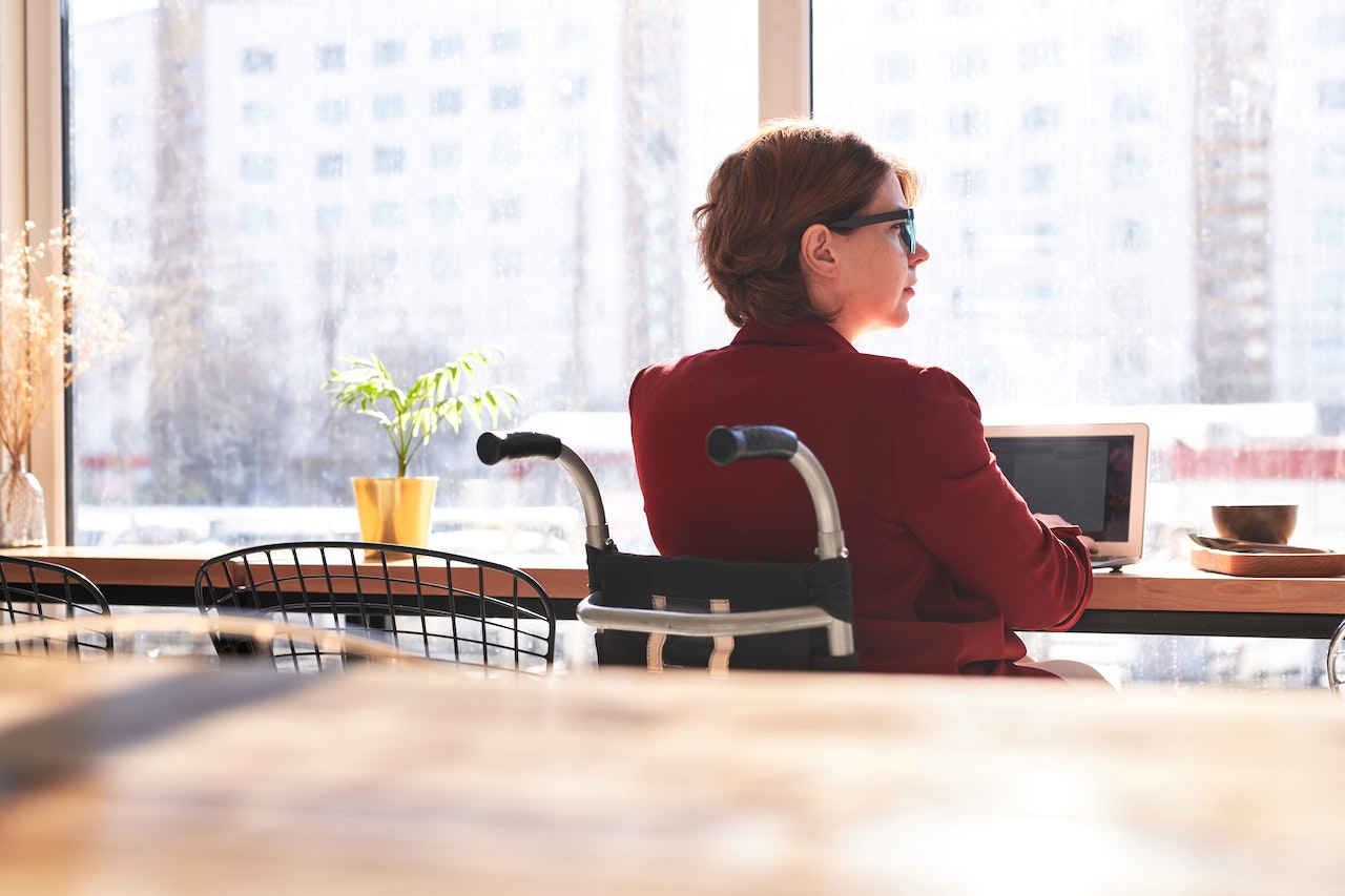 woman-on-wheelchair-working-alone-on-laptop-from-coffee-shop-intj-personality-type