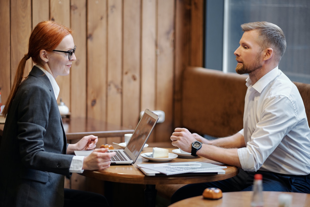 woman-recruiter-interviewing-man-at-office-questions-to-ask-at-the-end-of-an-interview