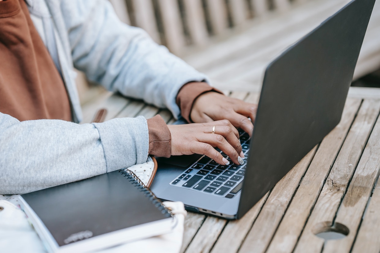 womans-hand-writing-on-laptop-keyboard-Thank-you-for-your-leadership-and-vision