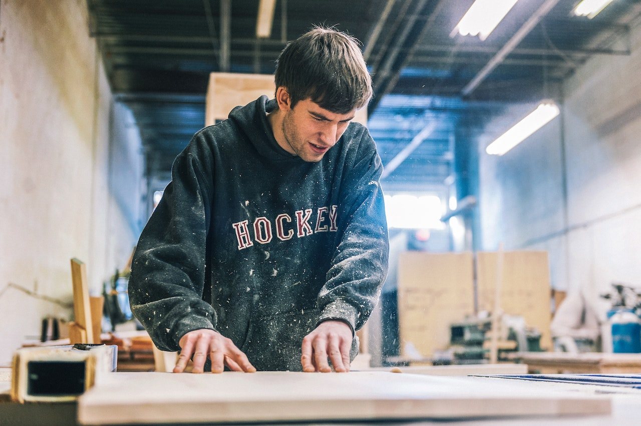 young-man-working-on-wood-shop-as-carpenter-vocational-skills