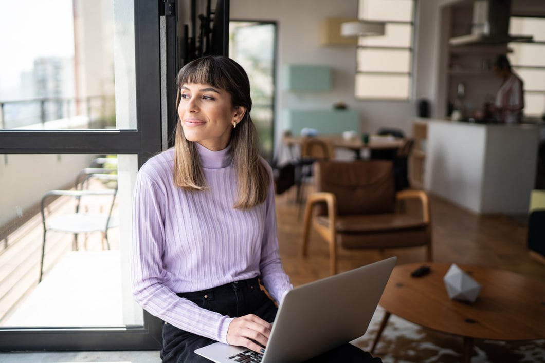 young-woman-sitting-by-the-window-inspired-short-term-professional-goals