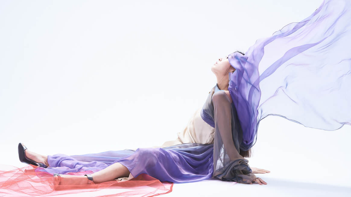 flow-state-person-sitting-with-scarf-blowing