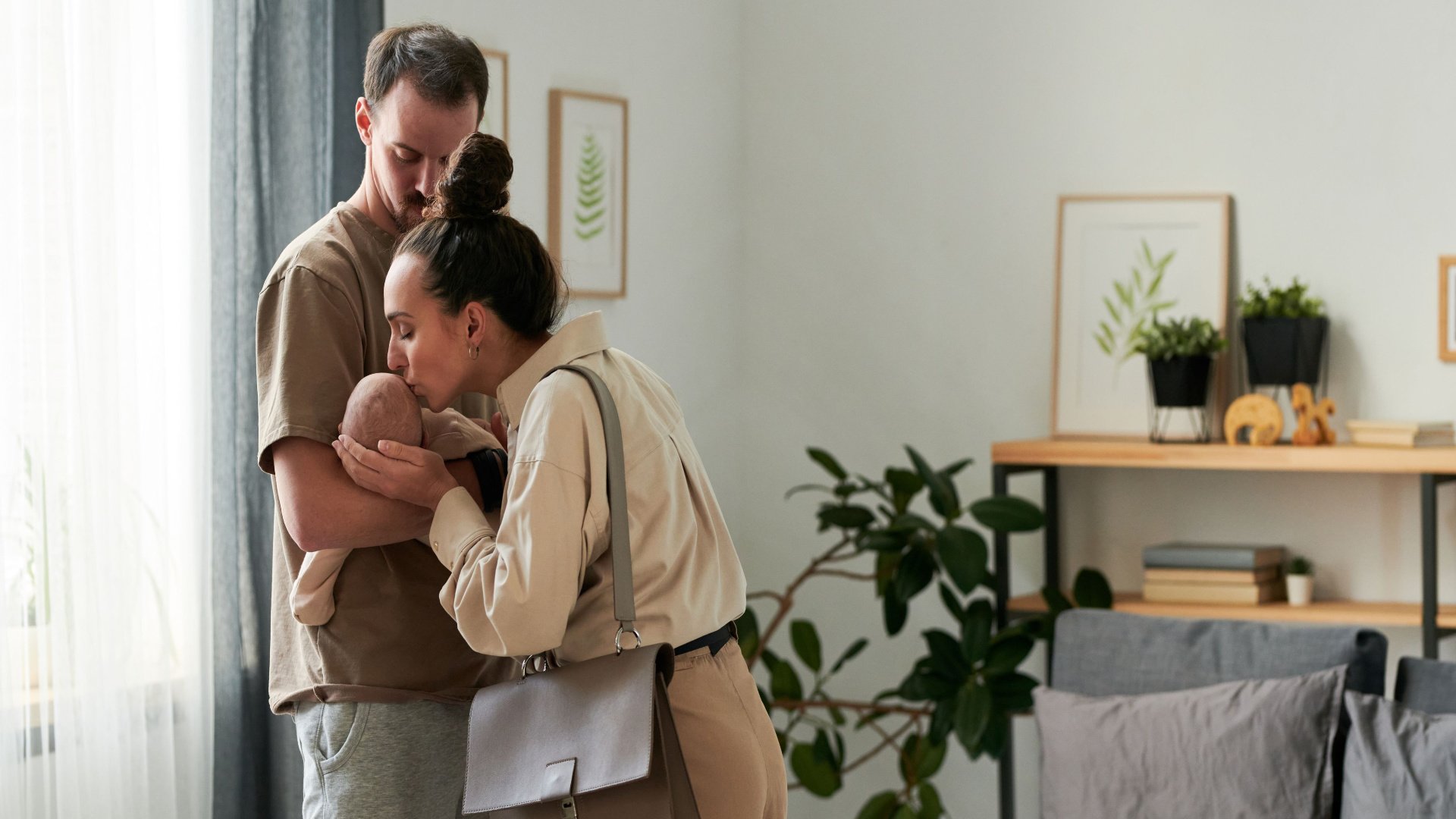 returnship-parents-holding-baby-leaving-for-work