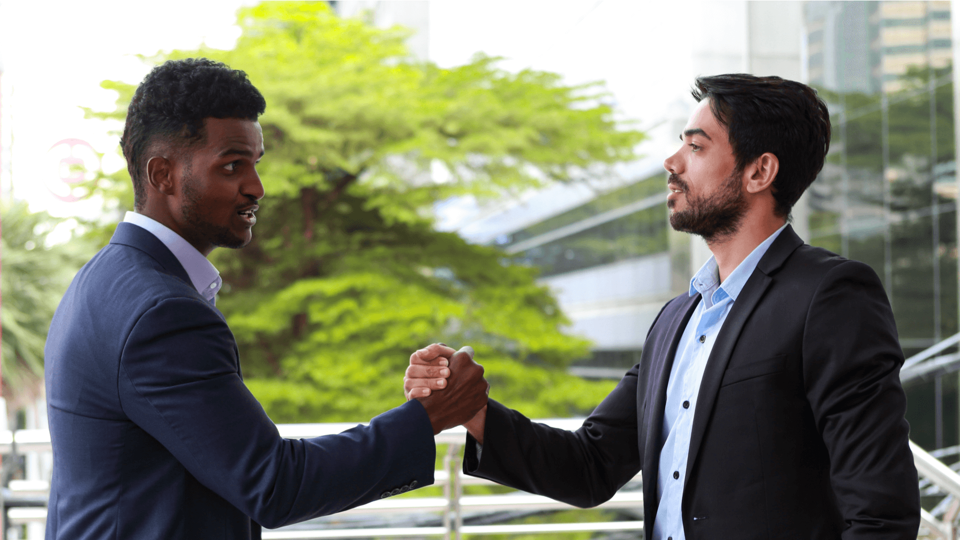 stack-ranking-two-people-shaking-hands