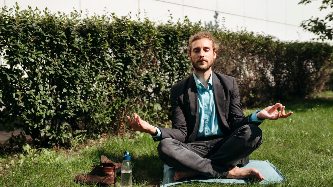 what-is sabbatical-person-doing-yoga-in-business-suit