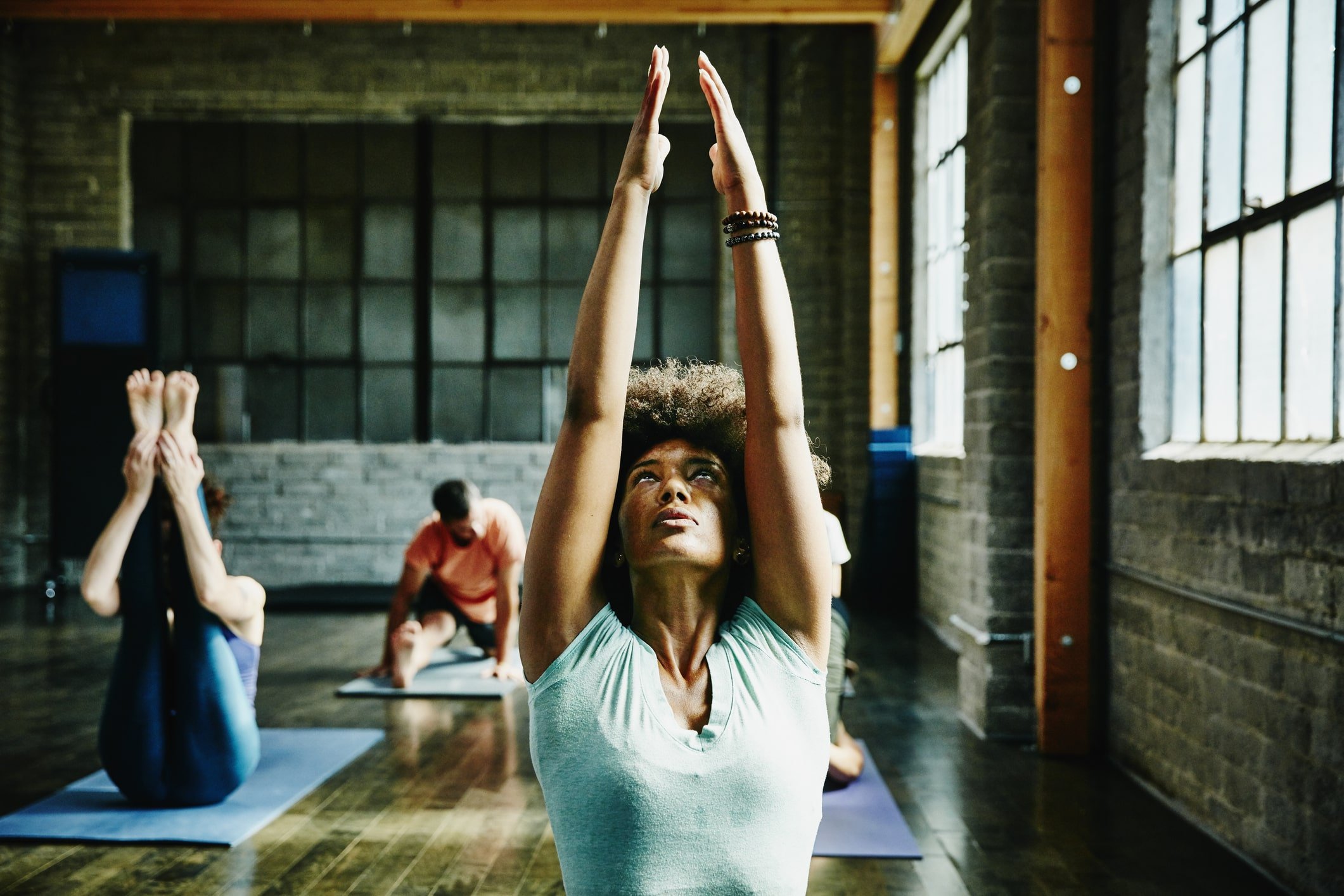 Woman-warming-up-for-yoga-class-in-studio-how-to-improve-self-control