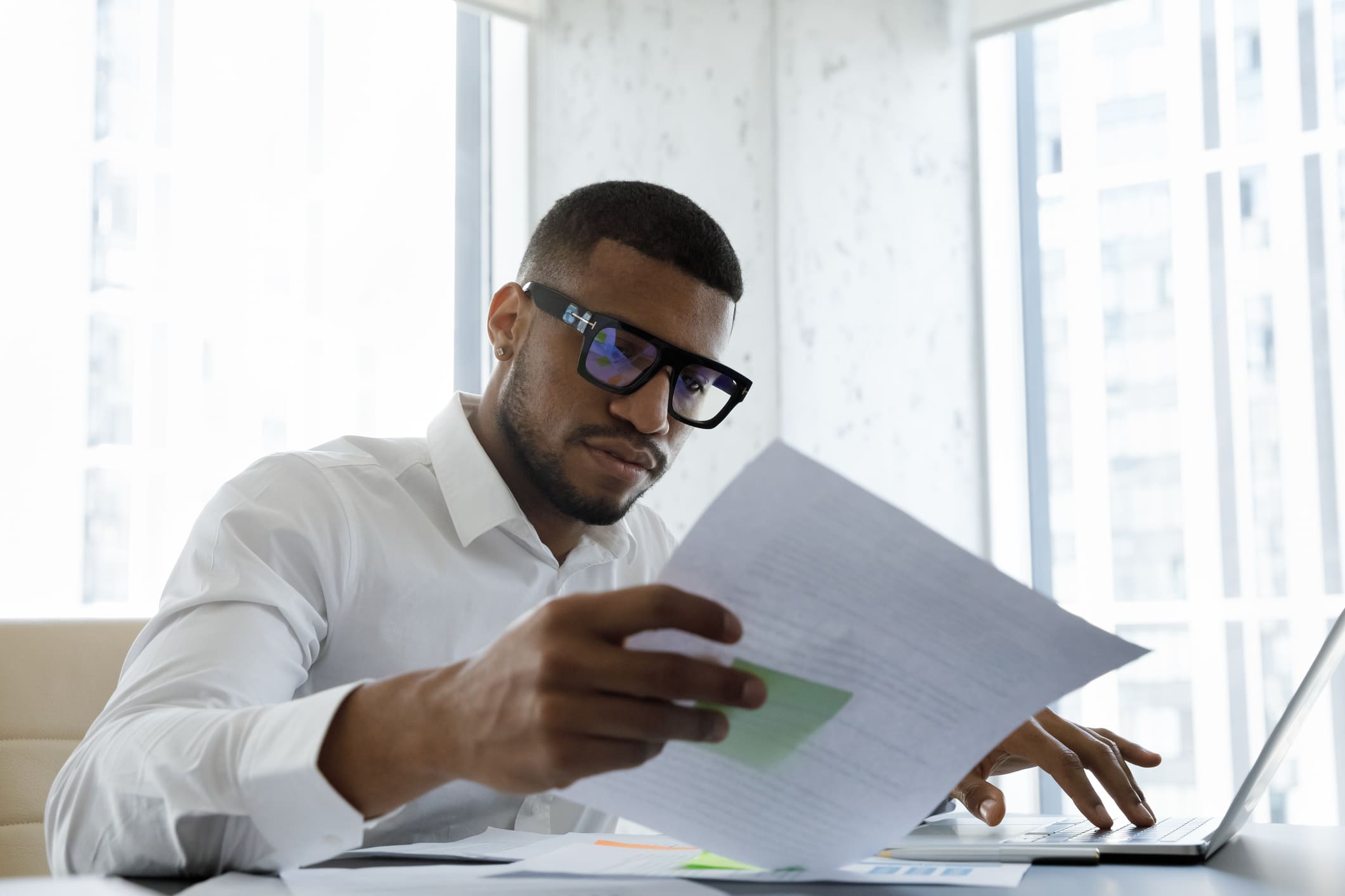 afro-man-looking-at-a-paper-sheet-full-time-vs-part-time-benefits