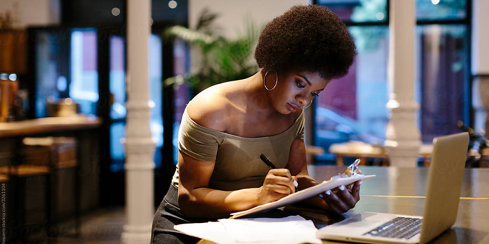 woman-working-on-notepad-and-laptop-ego-driven